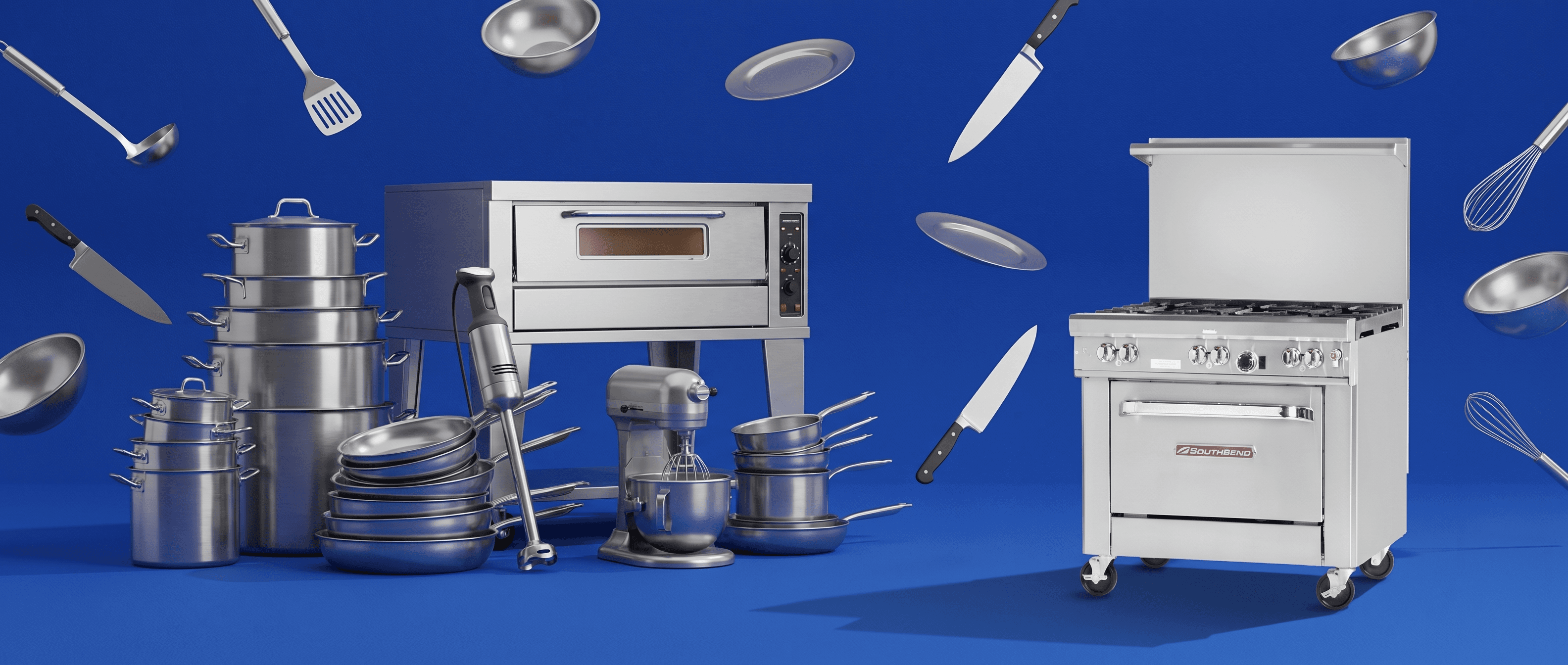 Commercial kitchen equipment and cookware arranged on a blue background